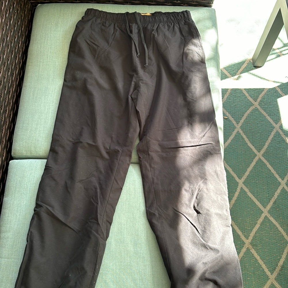 Black ski pants, lined. Zip bottom for boots. Excellent condition.